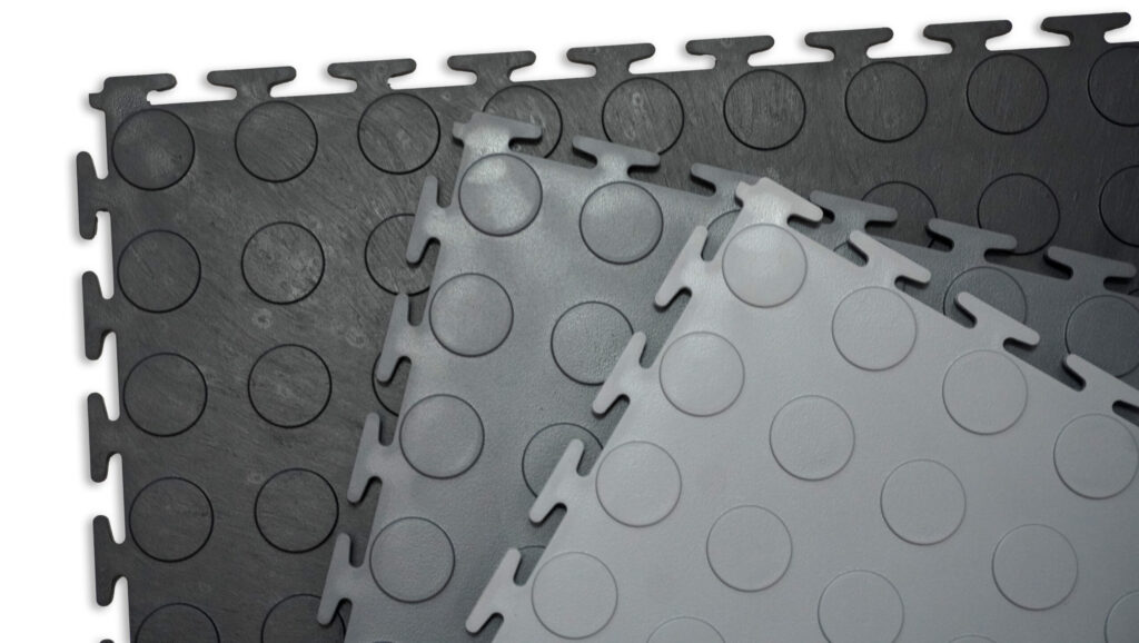 Puzzlink recycled PVC garage floor tiles in black, battleship grey and windsor grey shown side by side